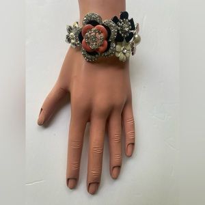 Bracelet made with flowers and stones.